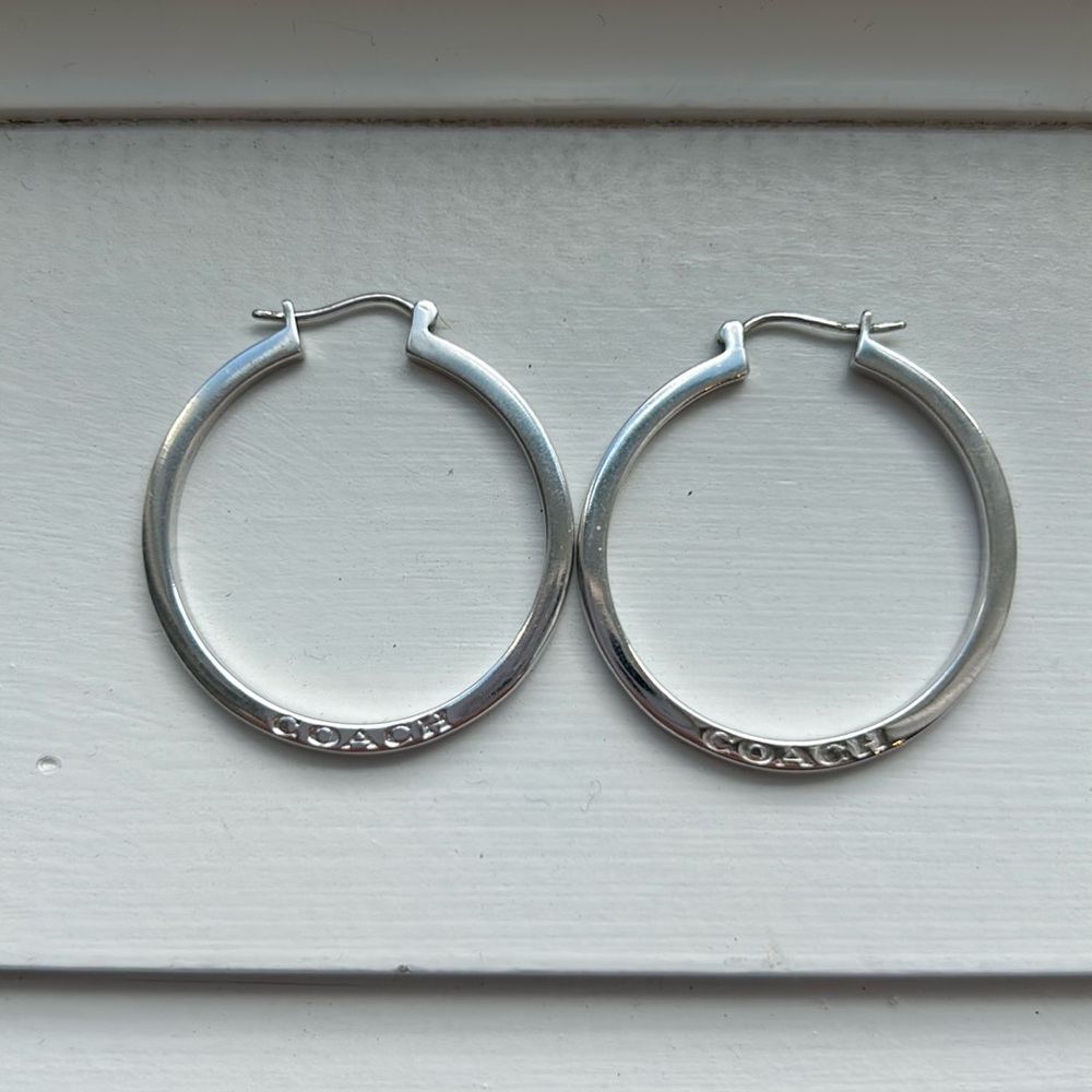 Stirling silver hoop Coach earrings